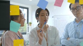 Close up asian business people meeting at office and use sticky notes share idea. Brainstorming ideas team concept . - Powered by Shutterstock - Get 15% off with code: PIKWIZARD15