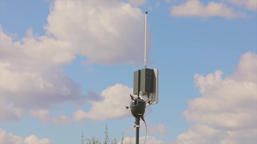 UAV ground antenna. Drone antenna. Rotating UAV antenna. Antenna against the blue sky Royalty-Free Stock Footage #1097109437
