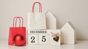 Christmas footage of unrecognizable female hand putting ornament in santa's hat on calendar with gift bags near - Powered by Shutterstock - Get 15% off with code: PIKWIZARD15