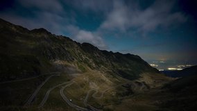 Amazing time lapse of star trails in the night sky over famous Transfagarasan mountain road in Romania. - Powered by Shutterstock - Get 15% off with code: PIKWIZARD15