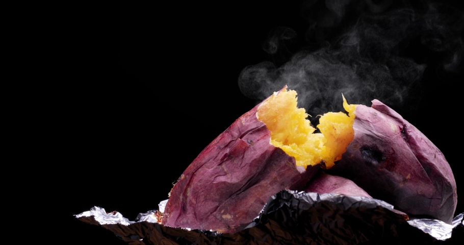 4K video of a steamy baked sweet potato while moving slowly. | Shutterstock HD Video #1097114141