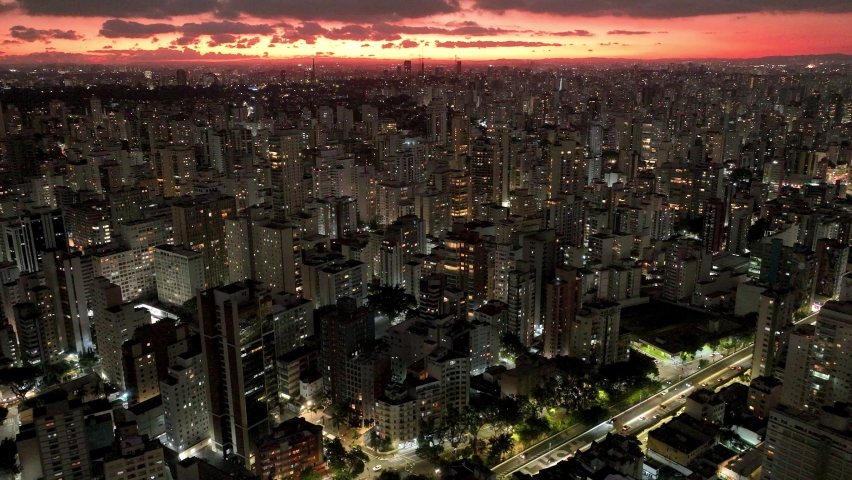 Sunset at Sao Paulo Brazil. Cityscape of sunset sky at city Sao Paulo Brazil. Scenic landscape of colorful sky and illuminated towers offices buildings and skyscrapers. Urban life scenery.