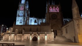 Tilt up shot of the Cathedral of Saint Mary, in Burgos, Spain illuminated at night. High quality 4k footage. 