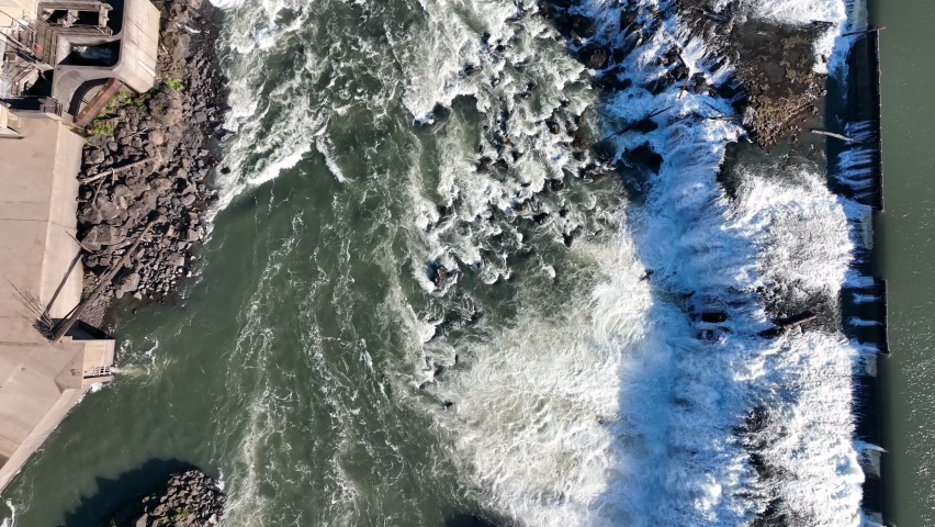 The Willamette Falls is a natural waterfall between West Linn and Oregon City, not far south of Portland, Oregon. By volume, this is the largest waterfall in the Northwestern United States.