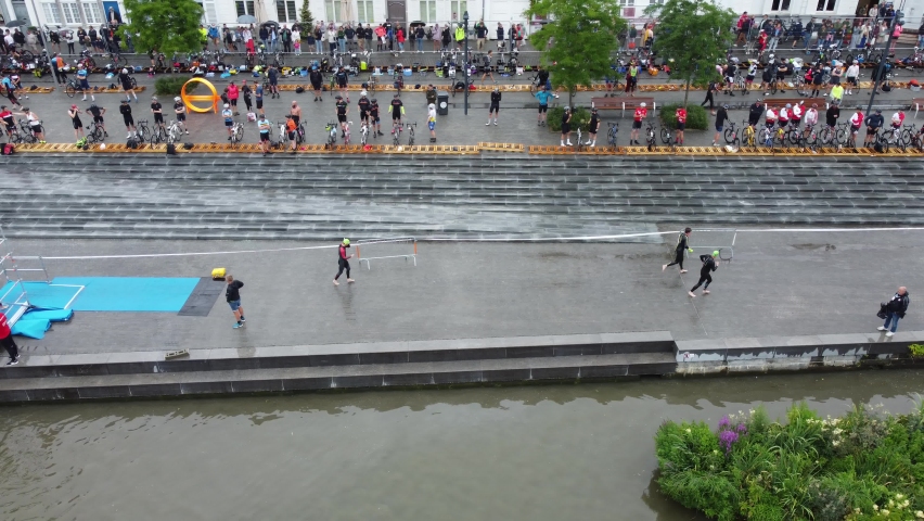 Swimmers running to the transition area drone video