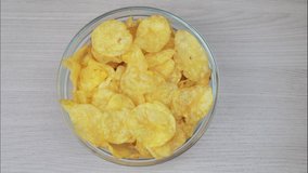 Eating Potato CHIPS - Time Lapse, top view video. Last crumble is emphasized.