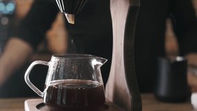 Process of making cup of coffee in V60. Barista at work make strong coffee into a paper filter - Powered by Shutterstock - Get 15% off with code: PIKWIZARD15