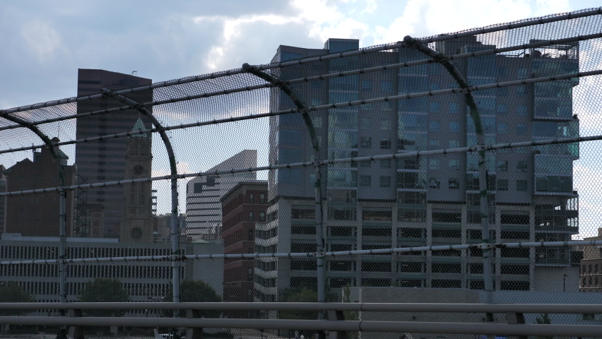 Driving in Cincinnati Ohio USA, Downtown Neighborhood Buildings View From Road Behind Fence