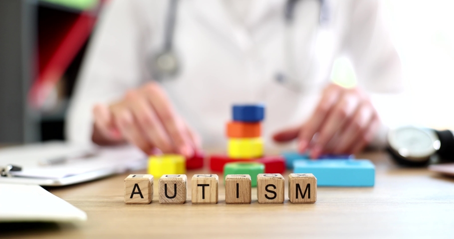 Autism inscription on cubes on the table, slowmotion Royalty-Free Stock Footage #1097147555