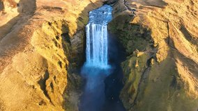 Skógafoss Waterfall, Iceland - Famous Skógafoss waterfall during sunrise, colorful waterfall scenery  - Drone video 4K colorgraded