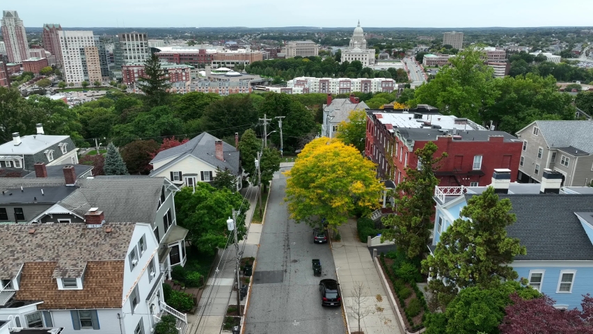Providence Rhode Island aerial establishing shot with state capitol dome in distance. Homes in residential area.