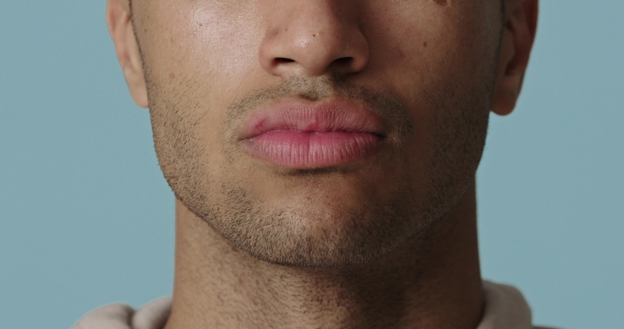 Closeup of man applying cream on beard zone. Handsome guy putting moisturizer on fresh soft pure skin. Portrait of man applying beauty cosmetics product. Man skin care concept | Shutterstock HD Video #1097159399