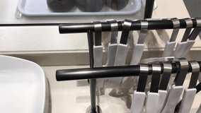 Food clamps and trays for customers to put food in a bakery in the supermarket. There are many customers and there are many types of bakery food.