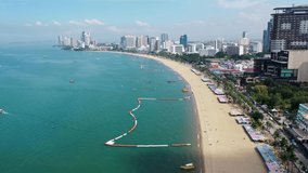 4K aerial beautiful Thailand Pattaya City during sunny day. Pattaya Beach, Coral Island and Buildings