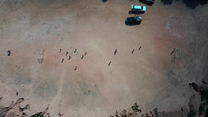 Top view of the football field for hill tribe children  at Omkoi district, Chiang Mai, Thailand. Cars parked at the village
