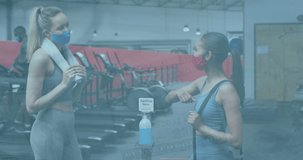 Animation of data processing with virus cells over diverse people at gym. Global sport, healthcare and digital interface concept digitally generated video.