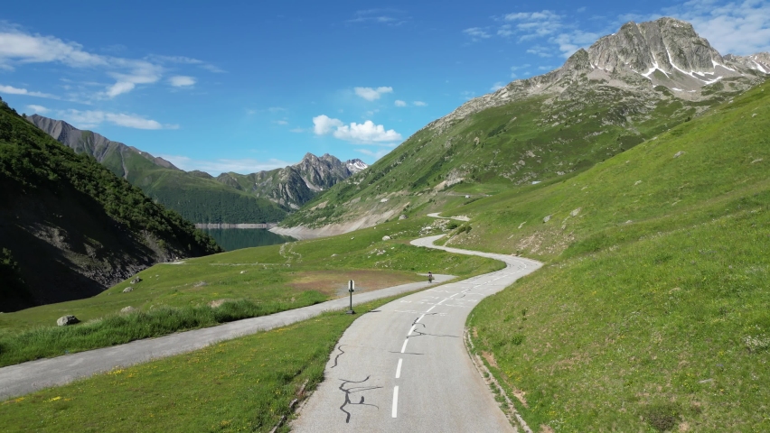 Scenic Road and Mountain Lake in French Alps, Isere Savoy - Aerial Pedestal Up