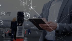 Animation of network of connections over caucasian businessman using tablet. Global business and digital interface concept digitally generated video. - Powered by Shutterstock - Get 15% off with code: PIKWIZARD15