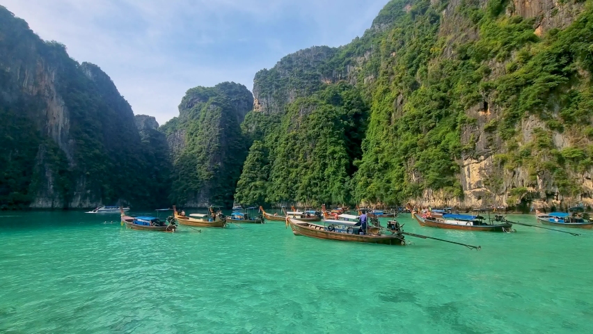 Pileh Lagoon Koh Phi Phi Thailand with the green emerald ocean at Koh Phi Phi Thailand in the morning with turqouse colored ocean | Shutterstock HD Video #1097182149
