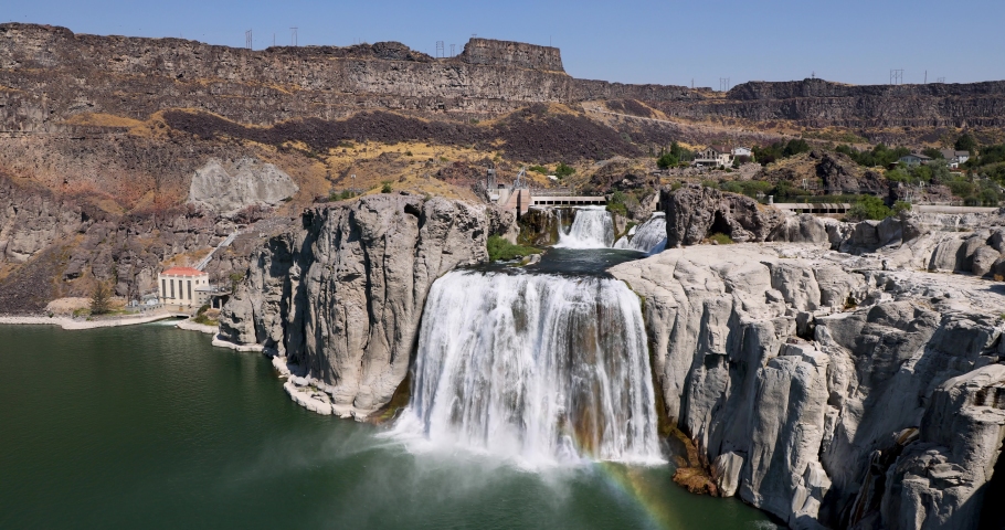 Twin Falls Idaho Snake River Waterfall rainbow 8K. Shoshone Falls. Irrigation and hydroelectric power stations is economic impact. Recreation, farming and electrical supply. Deep canyon.