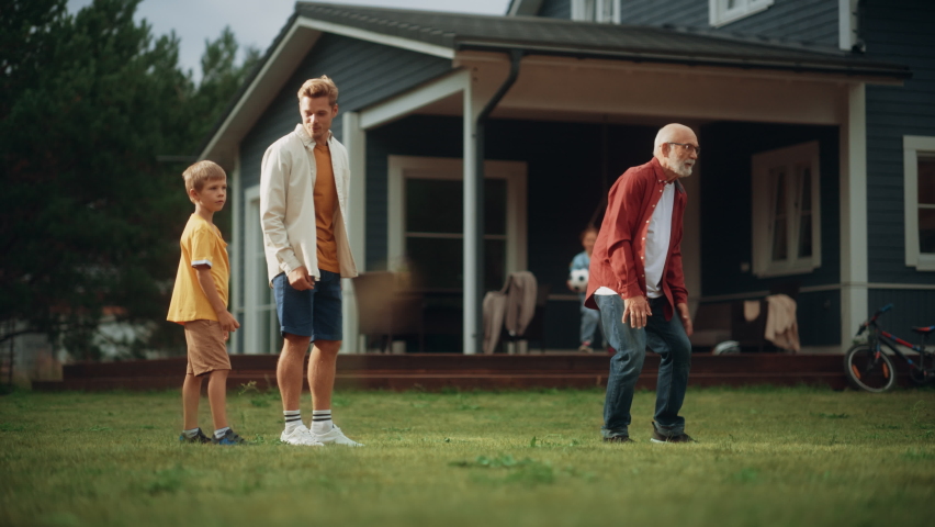 Grandfather Playing Ball with His Son and Grandchildren. Family Members Spending Leisure Time Outside with Kids and Pet Dog. People Throwing the Ball Between Each Other, Having Fun in Their Front Yard Royalty-Free Stock Footage #1097187937