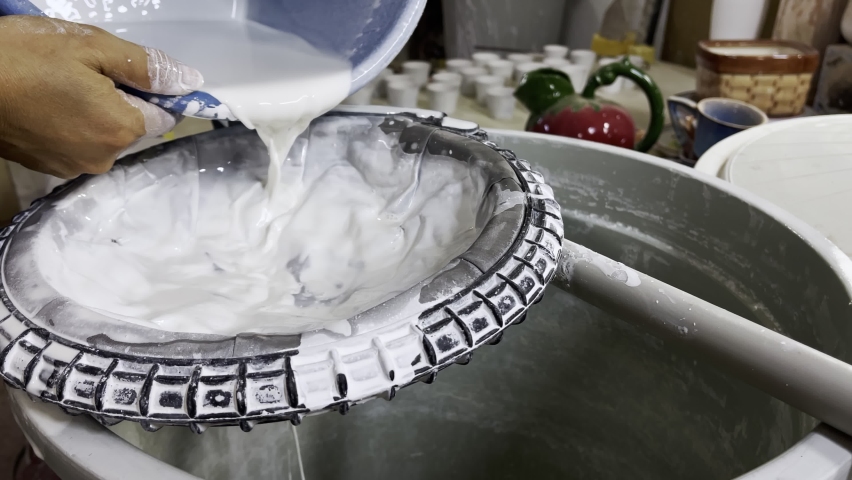 Pouring Glaze in a Ceramic Workshop | Shutterstock HD Video #1097192797