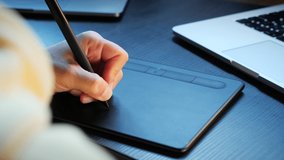 Designer working with interactive pen display. Female graphic designer using digital drawing tablet. Woman hand drawing fashion illustration using stylus - Powered by Shutterstock - Get 15% off with code: PIKWIZARD15