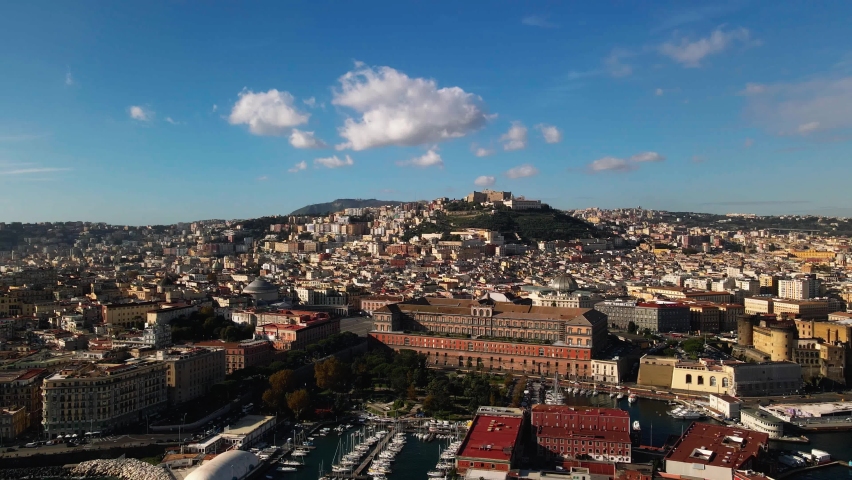 Panoramic drone view of the entire city of Naples in southern Italy. Flight over historical landmarks in Naples, Italy. Plebiscito central square and the historic castle of Sant