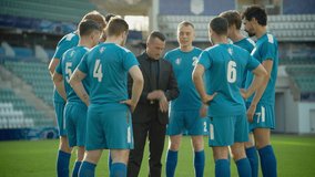 Professional Soccer Team Training, Tactical Coaching: Football Coach Explains Game Strategy, Tactics, Workout Plan to Players. Trainer Motivates Athletes, Leads to Victory, Preparing For Championship - Powered by Shutterstock - Get 15% off with code: PIKWIZARD15