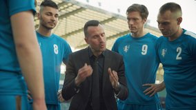 Professional Football Team Training, Tactical Coaching, Game Start, Stack Hands and Screem Hooray: Soccer Coach Explains Game Strategy. Trainer Motivates Athletes, Leads to Victory on Championship - Powered by Shutterstock - Get 15% off with code: PIKWIZARD15
