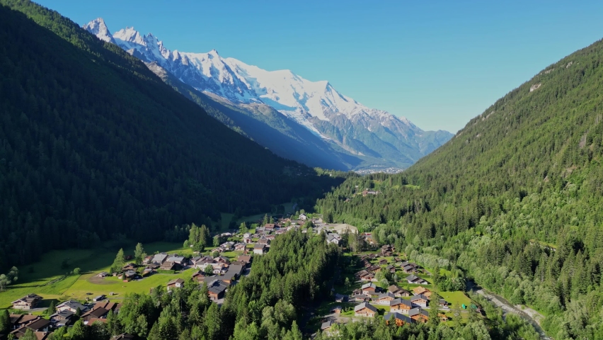 Mont Blanc Glacier and Chamonix Village during Sunny Summer day - Aerial Royalty-Free Stock Footage #1097201105