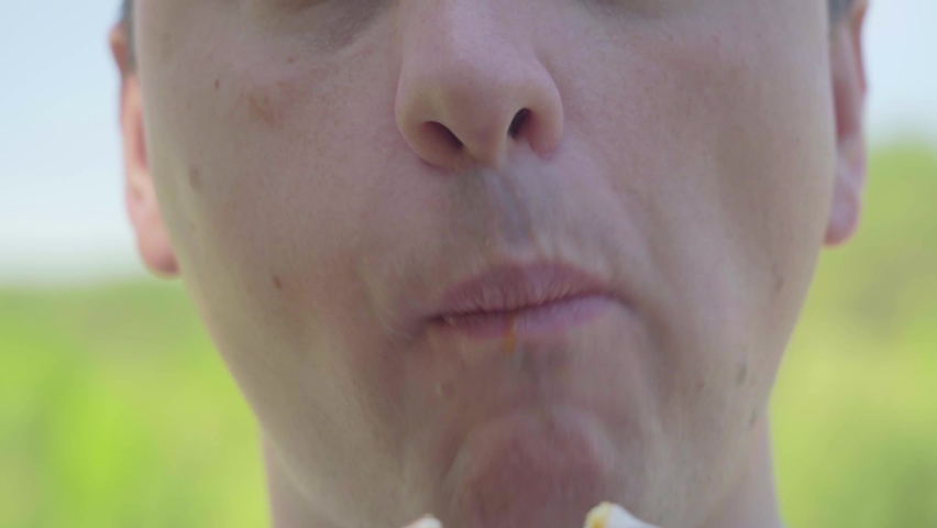A fat man eating a doughnut. Close-up of the lips. | Shutterstock HD Video #1097203687