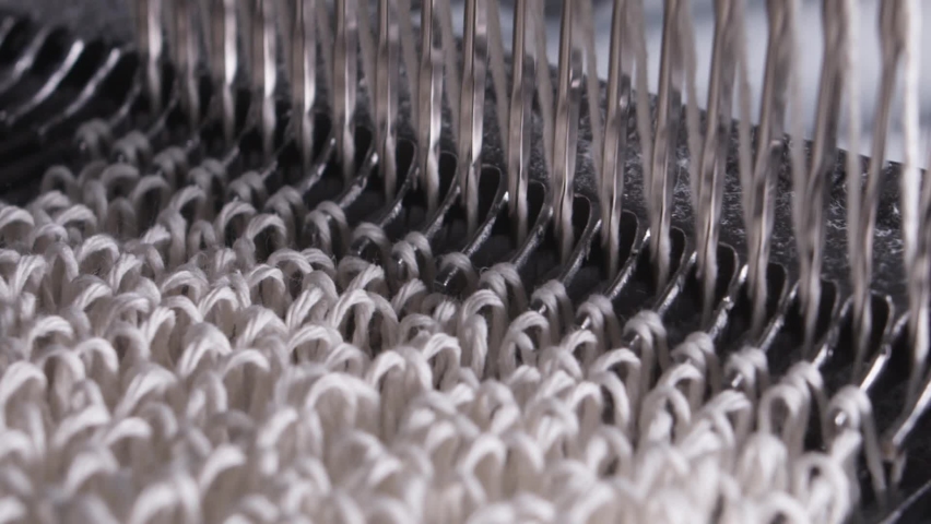 Closeup of weaving mechanism is fabricating synetic MOP Royalty-Free Stock Footage #1097204613