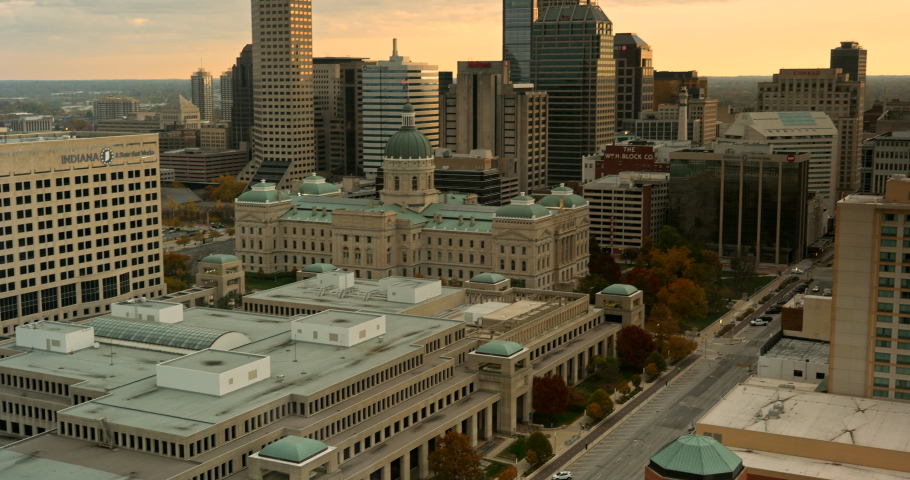 City skyline view over the downtown buildings and statehouse of Indianapolis, Indiana, USA at sunrise