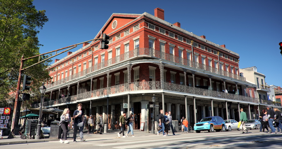 New Orleans, Louisiana - November 20, 2021: Crowds of people walk along the French Quarter outdoor market stalls, bars and restaurants around Jackson Square in New Orleans Louisiana USA