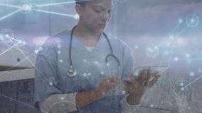 Animation of biracial female doctor over network of connections. Global medicine and digital interface concept digitally generated video. - Powered by Shutterstock - Get 15% off with code: PIKWIZARD15