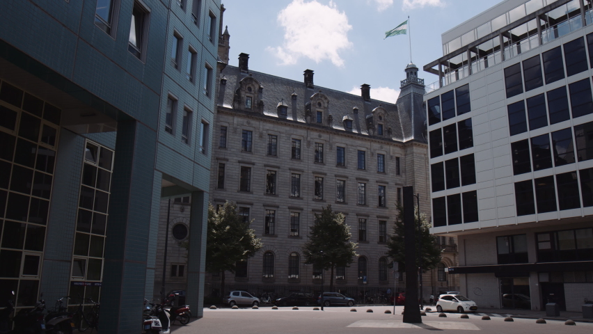 Slowmotion dolly shot of Rotterdam town hall, surrounded by office buildings, Netherlands