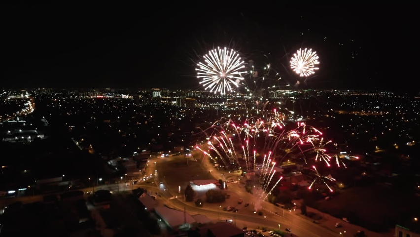 Shooting from a drone. A solemn royal salute against the background of the night sky. Fireworks for a holiday in the night city. | Shutterstock HD Video #1097229023