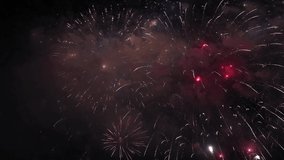 Fireworks with sparkles. New year celebration concept 4K footage. Festival or christmas celebration or 4th July background video.