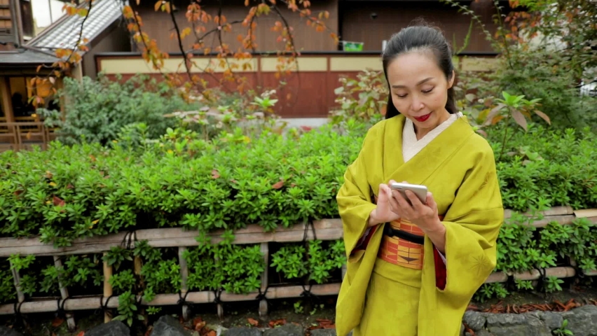 Elegant Japanese woman wearing a Kimono in Kyoto Japan.