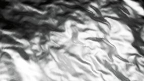 The background is a 3D animation of shiny folds. Silver foil abstraction and floating dents. Waves of metallic sheen. 3D Illustration - Powered by Shutterstock - Get 15% off with code: PIKWIZARD15