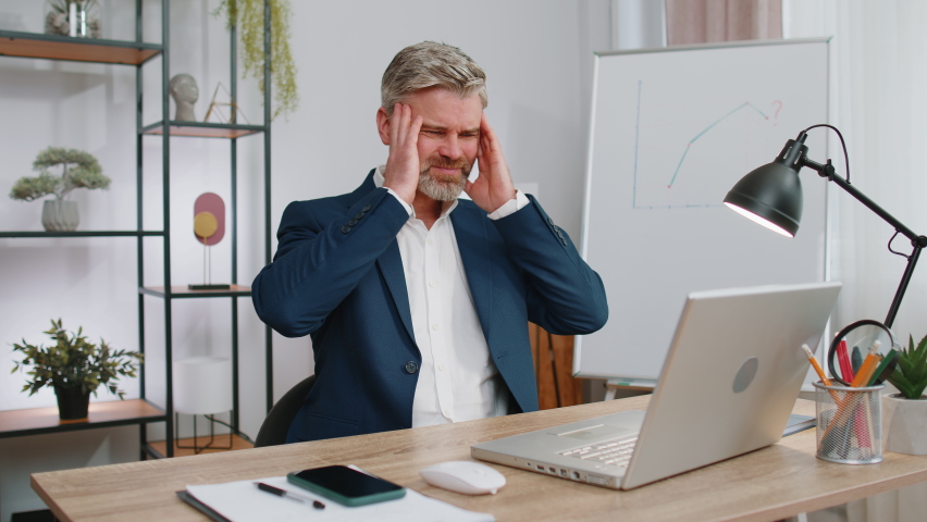 Businessman programmer software developer working on laptop loses becoming surprised sudden lottery results, bad news, fortune loss fail at office. Concentrated freelancer business gray-haired old man | Shutterstock HD Video #1097242549