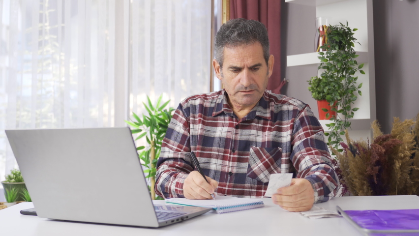 Family man looking after food bills is having financial difficulties.
The man who calculates the grocery bills and household expenses is experiencing financial difficulties.
 | Shutterstock HD Video #1097243011