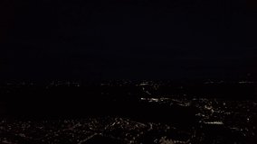 Aerial Footage view of British City and illuminated streets and roads at Night, Drone's camera view