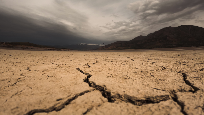 Cracked land Timelapse with Dramatic clouds, lack of freshwater global warming climate change concept, Cracked soil in a desert dry land , ecological issues, water crisis, increased temperatures | Shutterstock HD Video #1097257347