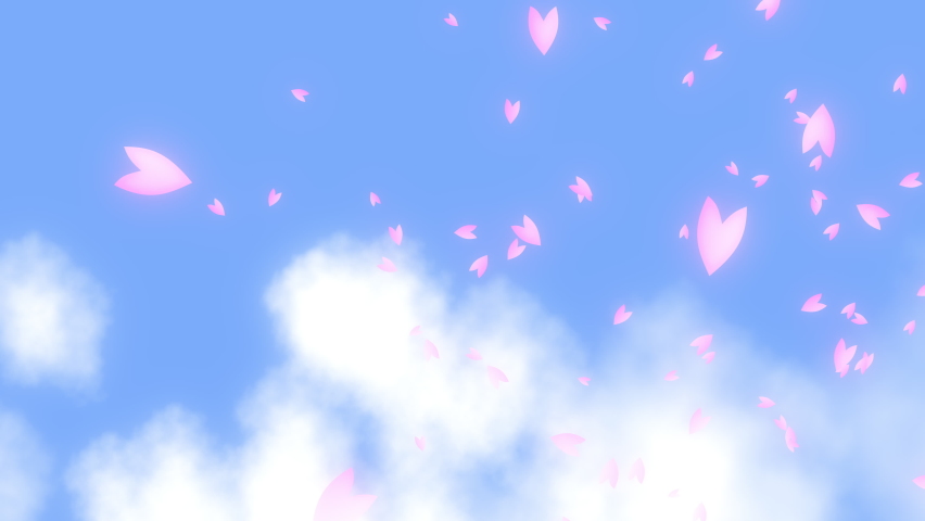 Pink cherry petals falling and drifting from right to left in the wind over the white clouds in the blue sky. A scene of springtime in Japan.
