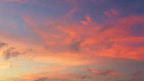 pink cloud in sky at sunset above the sea video 4K. Nature video High quality footage. 
Scene of Colorful romantic sky sunset with orange color of the sky background.
aerial view scenery sunset.