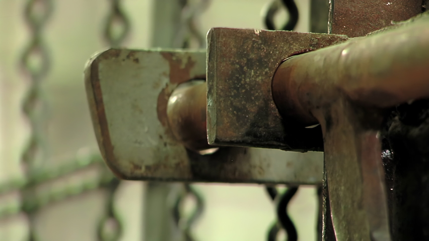 Metal Door in an Old Argentinian Prison, Jail Guard Opening and Closing an Old Metal Door in Prison. Close Up. 4K Resolution. Royalty-Free Stock Footage #1097262885