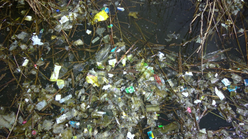 Environmental pollution. Rubbish and plastic floats in the water | Shutterstock HD Video #1097267795