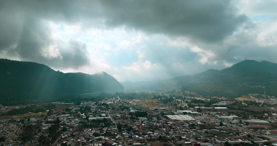 Aerial hyperlapse footage of clouds around the mountain in beautiful San Cristobal De Las Casas in Mexico. Sunset.